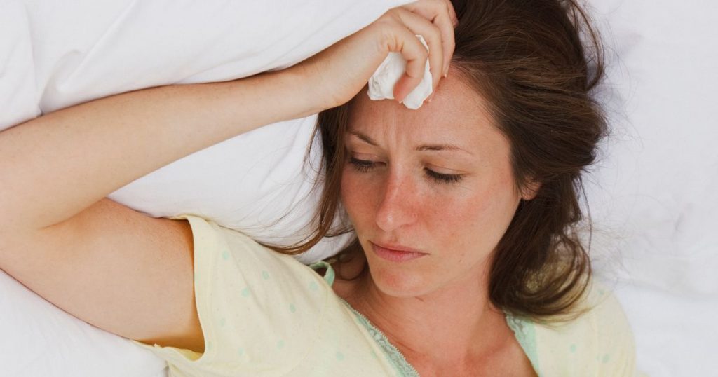 0_Sick-woman-laying-in-bed.jpg